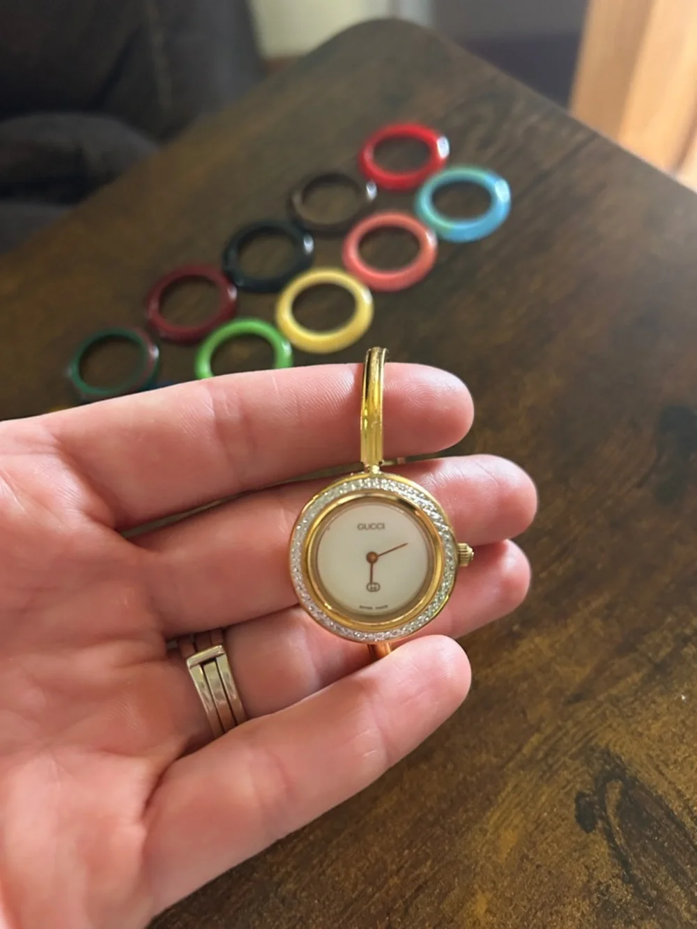 Gucci Gold Bangle Watch with Assorted Colored Interchangeable Bezels